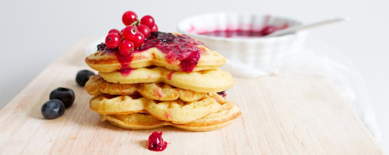 waffles coverd in berry sauce